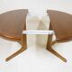 Expandable round teak table