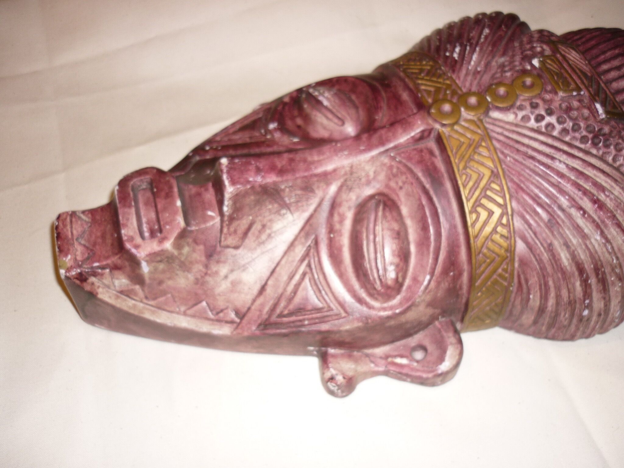 African mask in earth