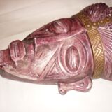 African mask in earth