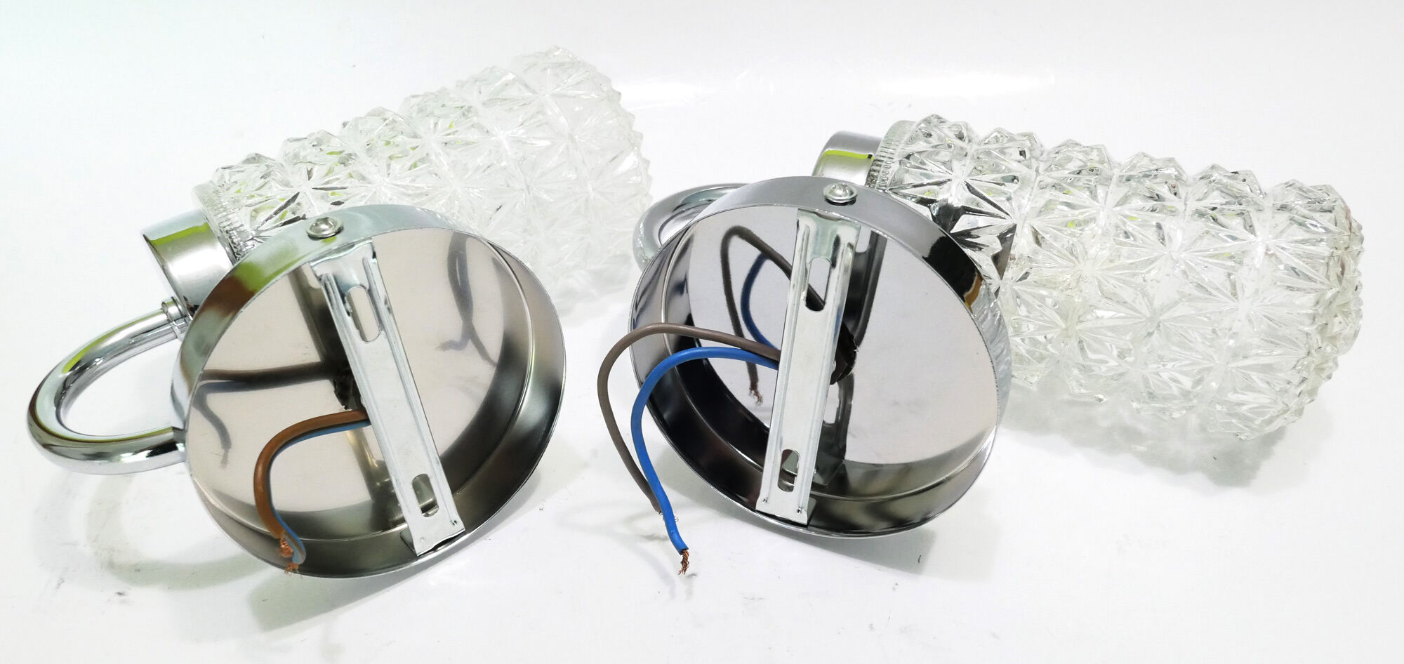 Pair of 1970 chrome metal wall light and molded glass globes.