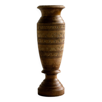 Carved wooden vase sculpture.