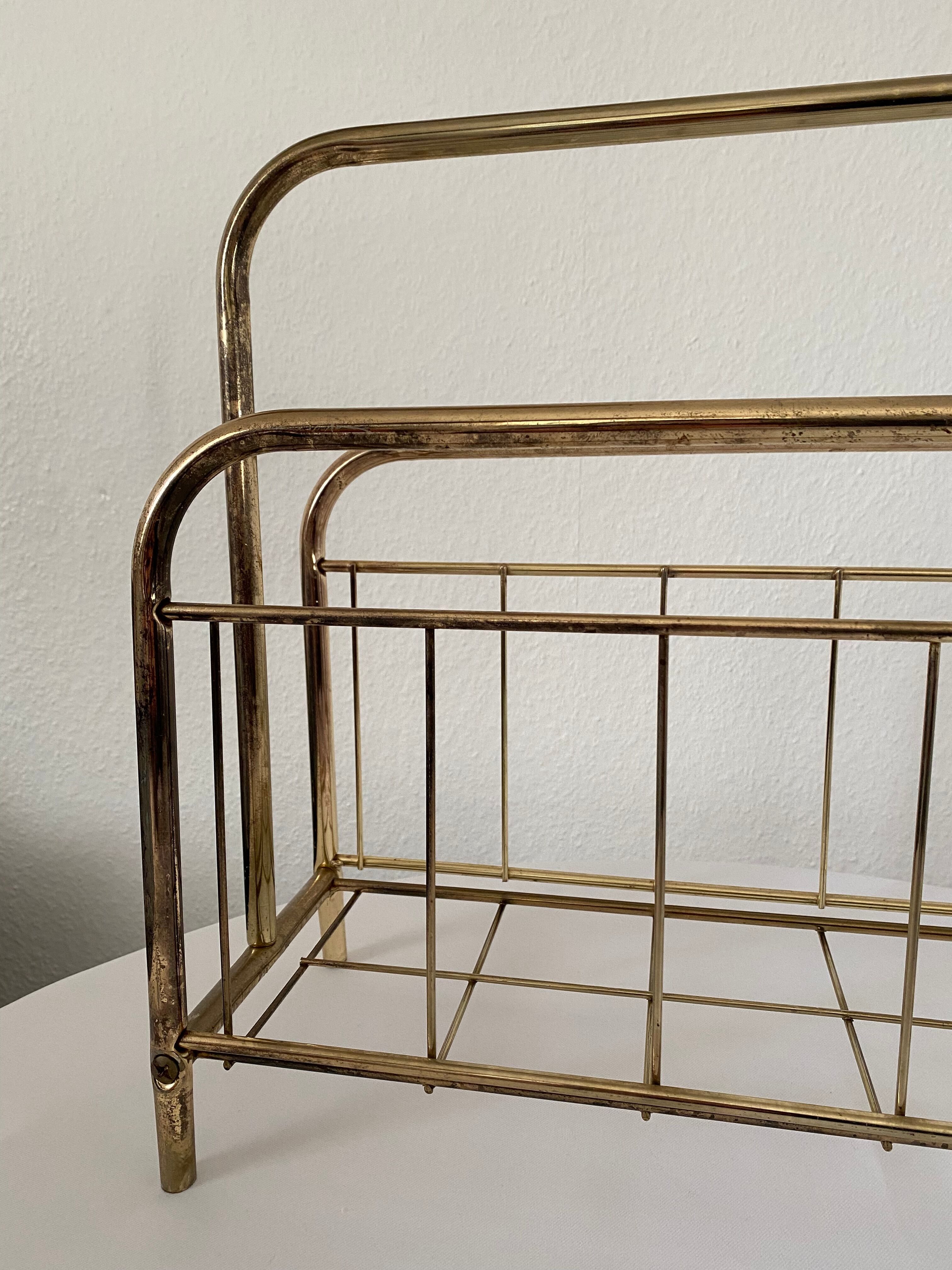 Gilded metal magazine door