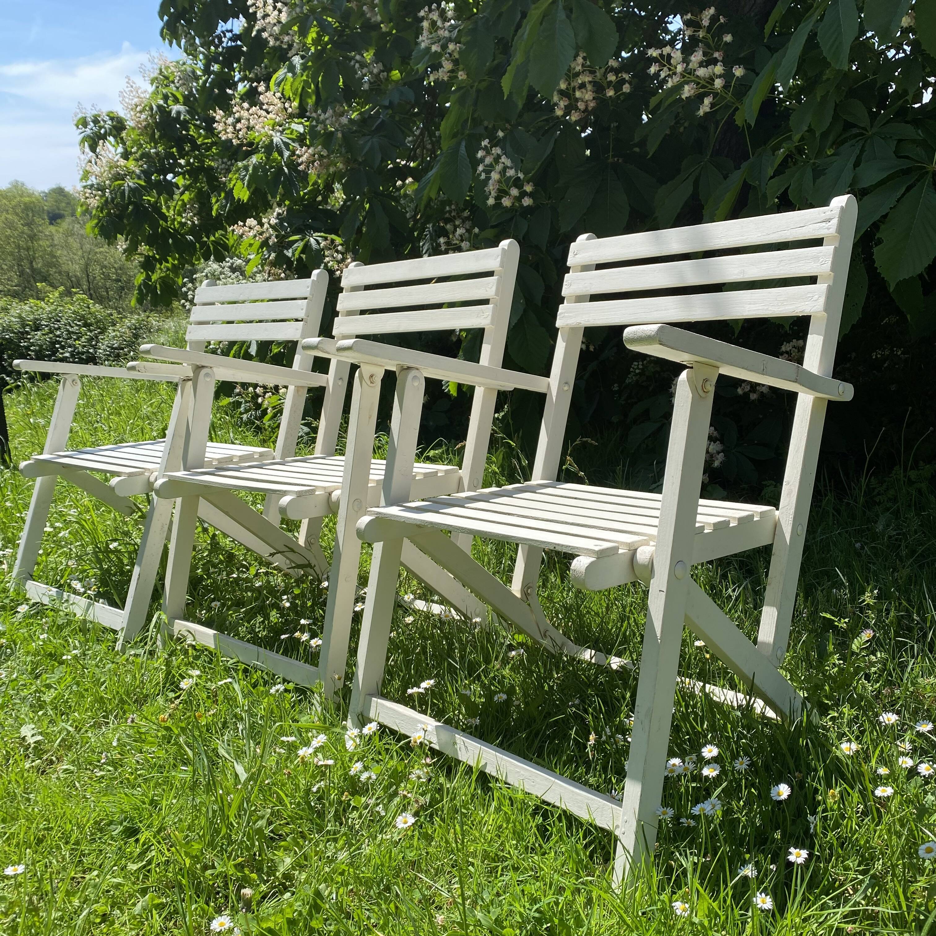 Folding slatted garden armchairs