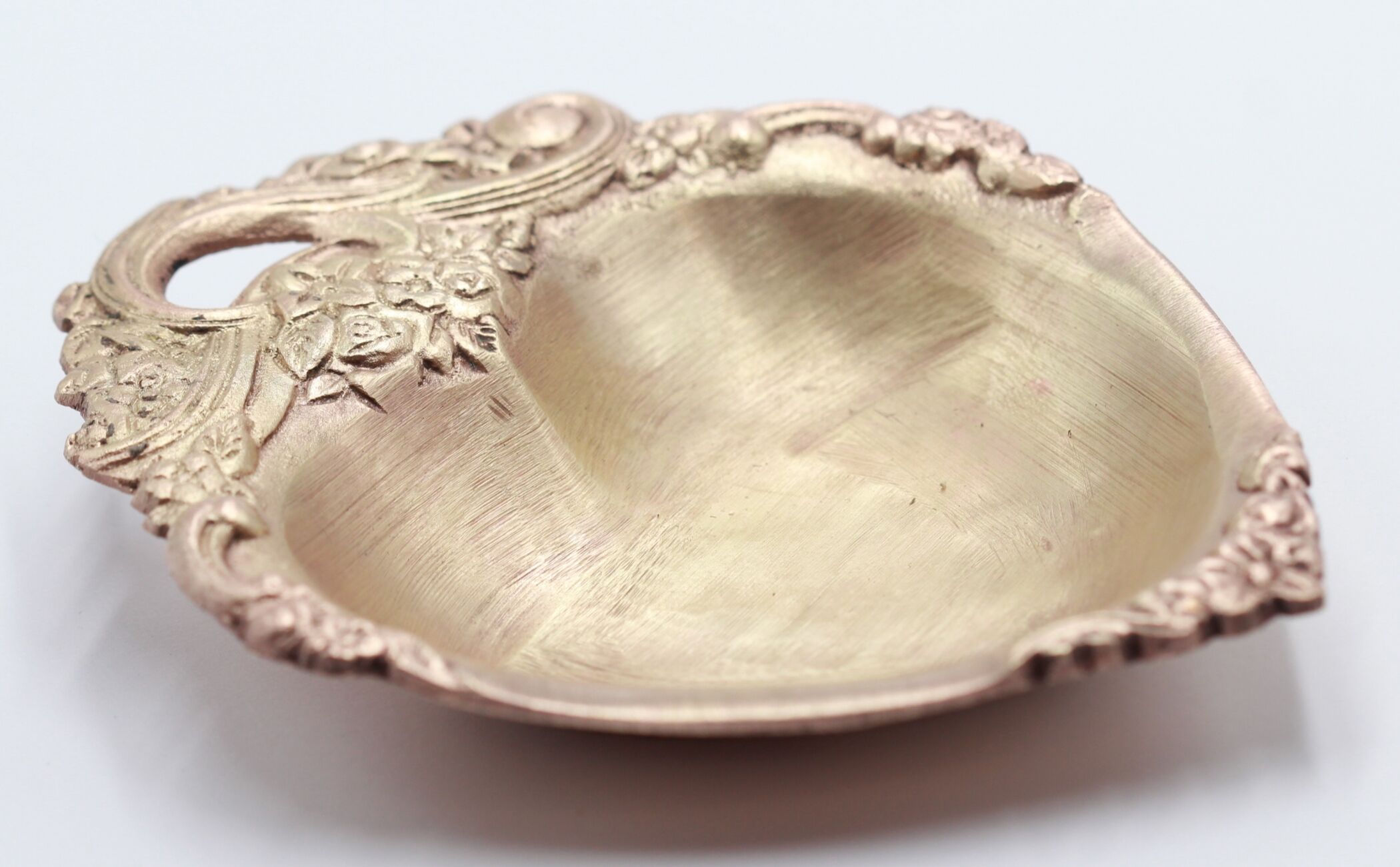 Empty brass heart pocket