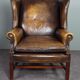 Fauteuil en cuir de vachette patiné