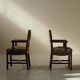 Pair of modernist armchairs in solid oak, France, circa 1940.