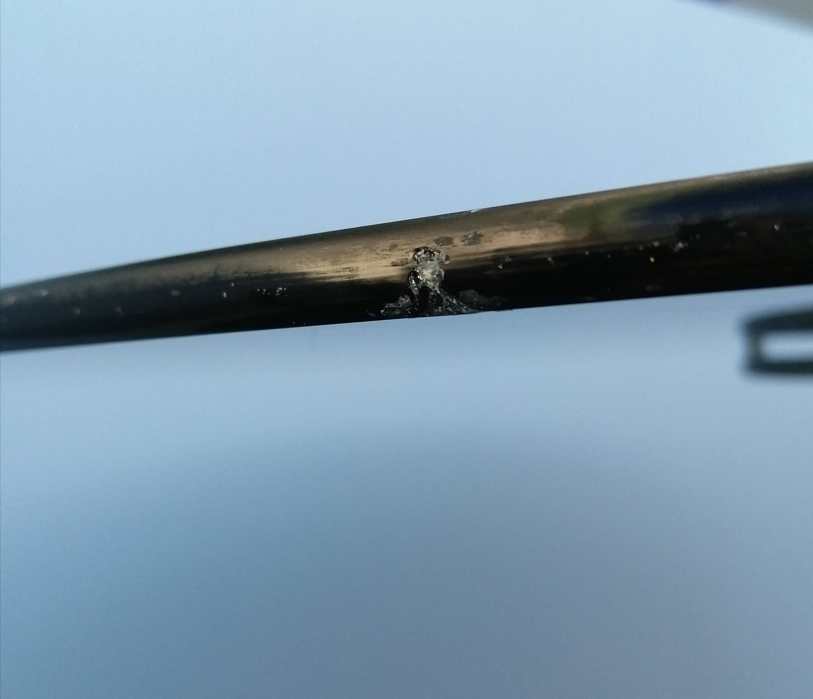 Wrought iron dining table with its round smoked glass top, vintage 1980