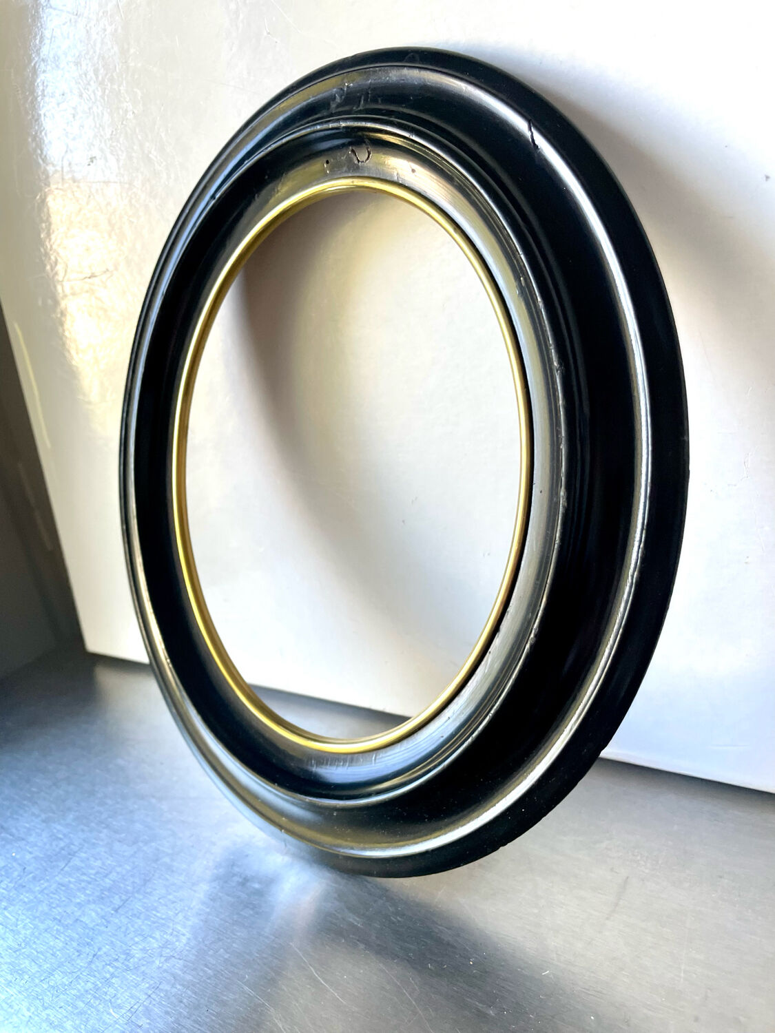 Black wooden oval frame