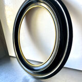 Black wooden oval frame