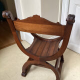 Gothic Curule Dagobert armchair in carved walnut, 19th century