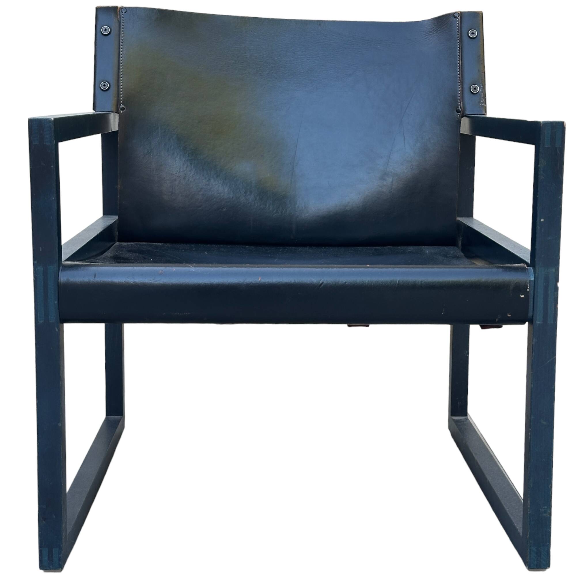 Postmodern lounge chair in black saddle leather and midnight blue wood, 1980.