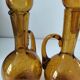Duo of blown glass carafes – Biot signed – Bubbled amber glass