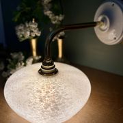 Vintage glass wall lamp with a curved arm from Clichy, white.