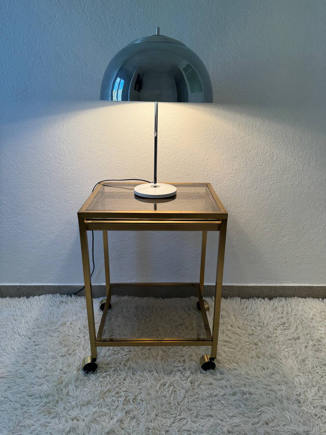 Brass rolling trolley with smoked glass from the 70s