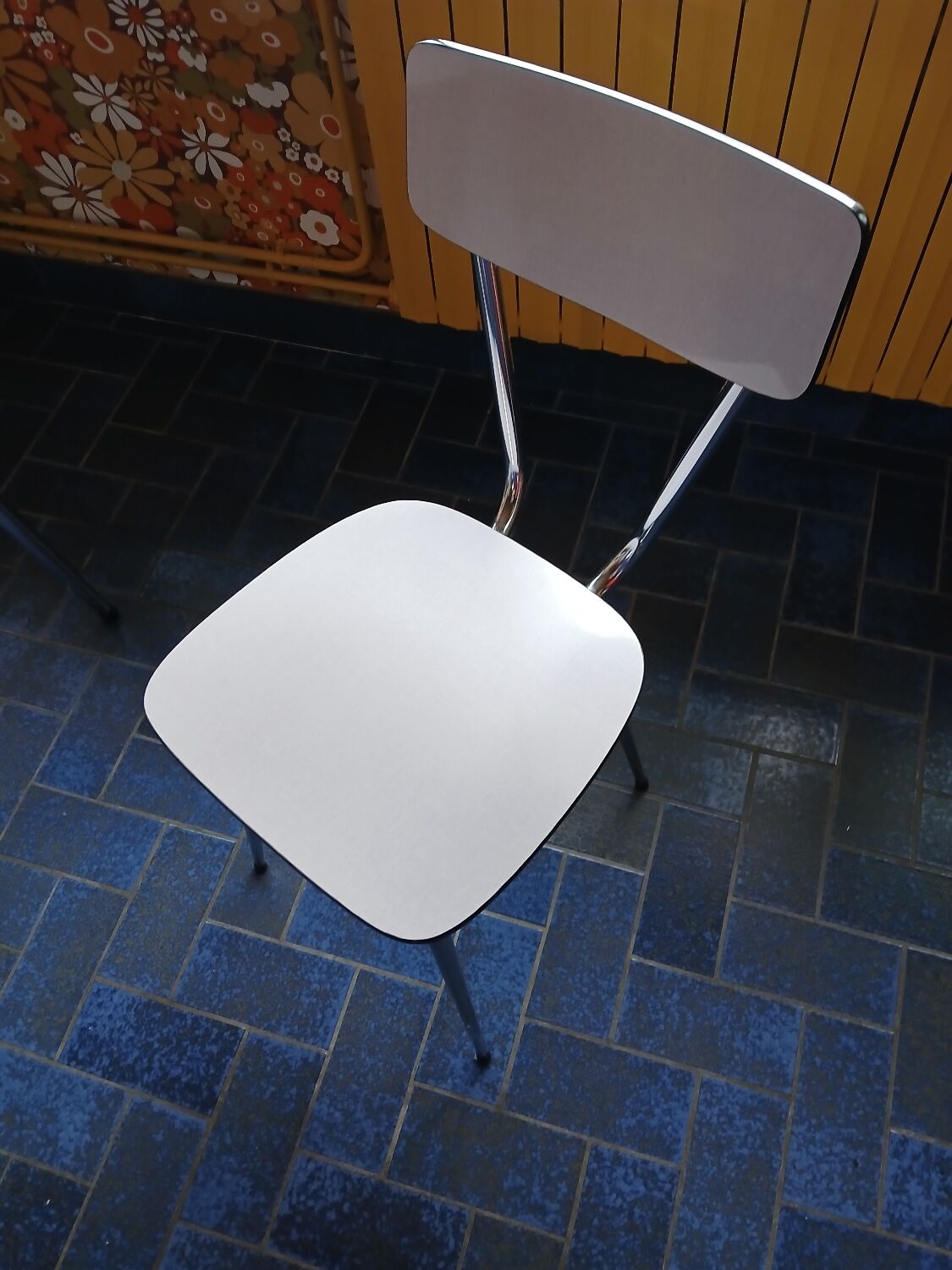 Extendable formica table and vintage 1960s chairs.