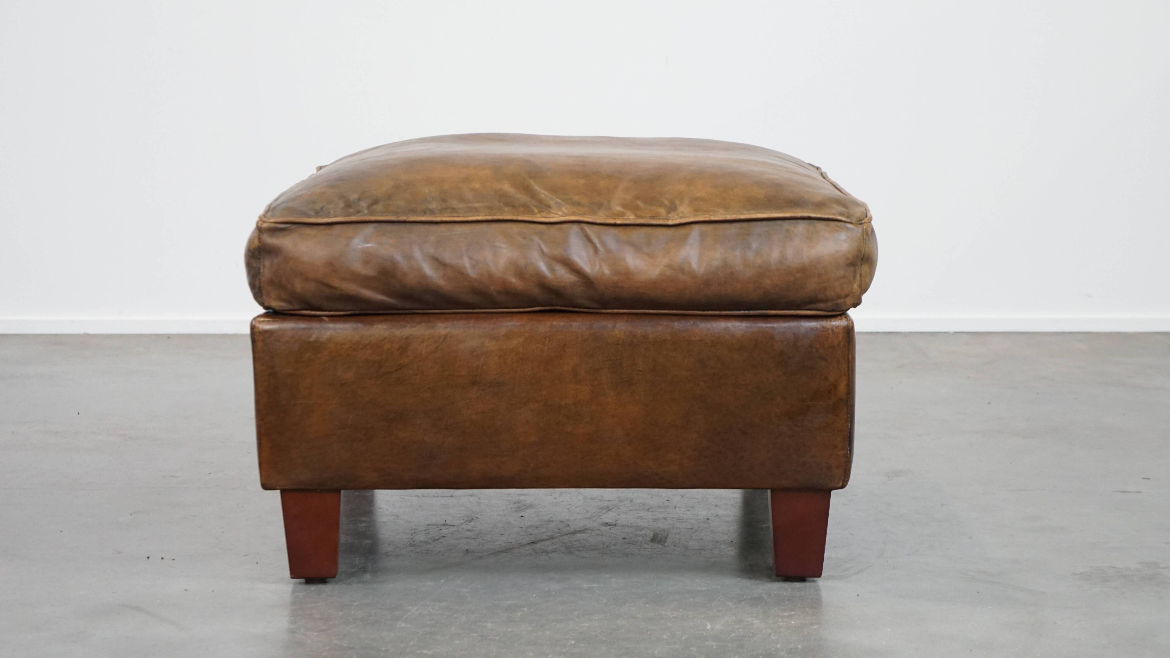 Sheepskin wing chair + XXL patinated footrest
