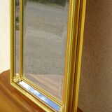 Hall mirror, gilded frame with fillets and fleur-de-lis.