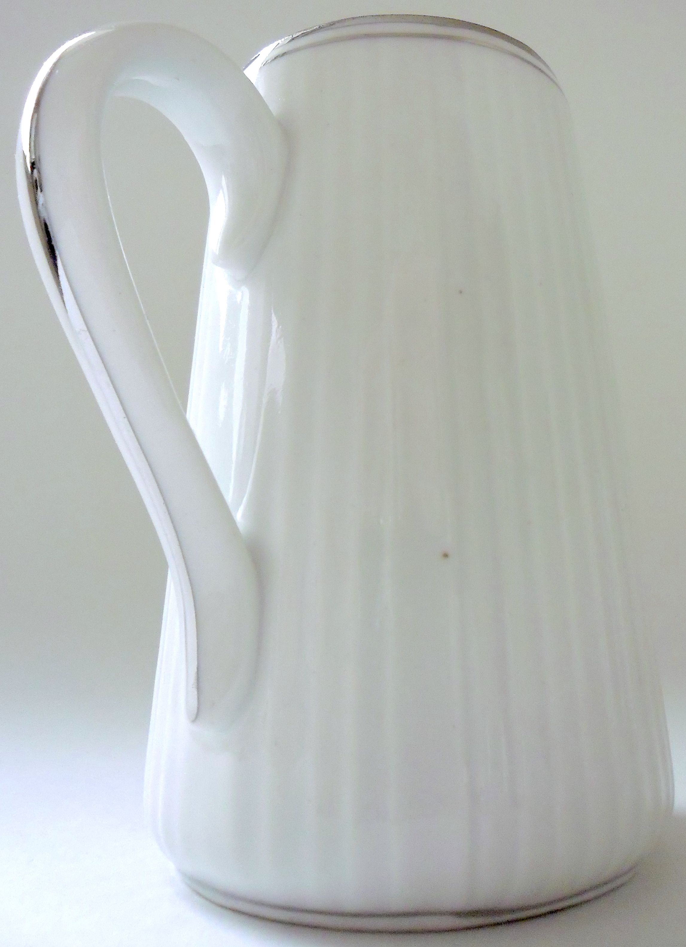 Pair of creamers in white porcelain enhanced with platinum