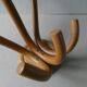 Bistro coat holder with curved wooden pads