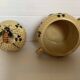 Old honey pot with bee decoration