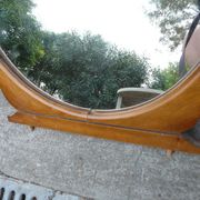 Round mirror on 60's furniture