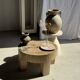 Petrified wood catchall or dish in beige with several grey spots in the centre.