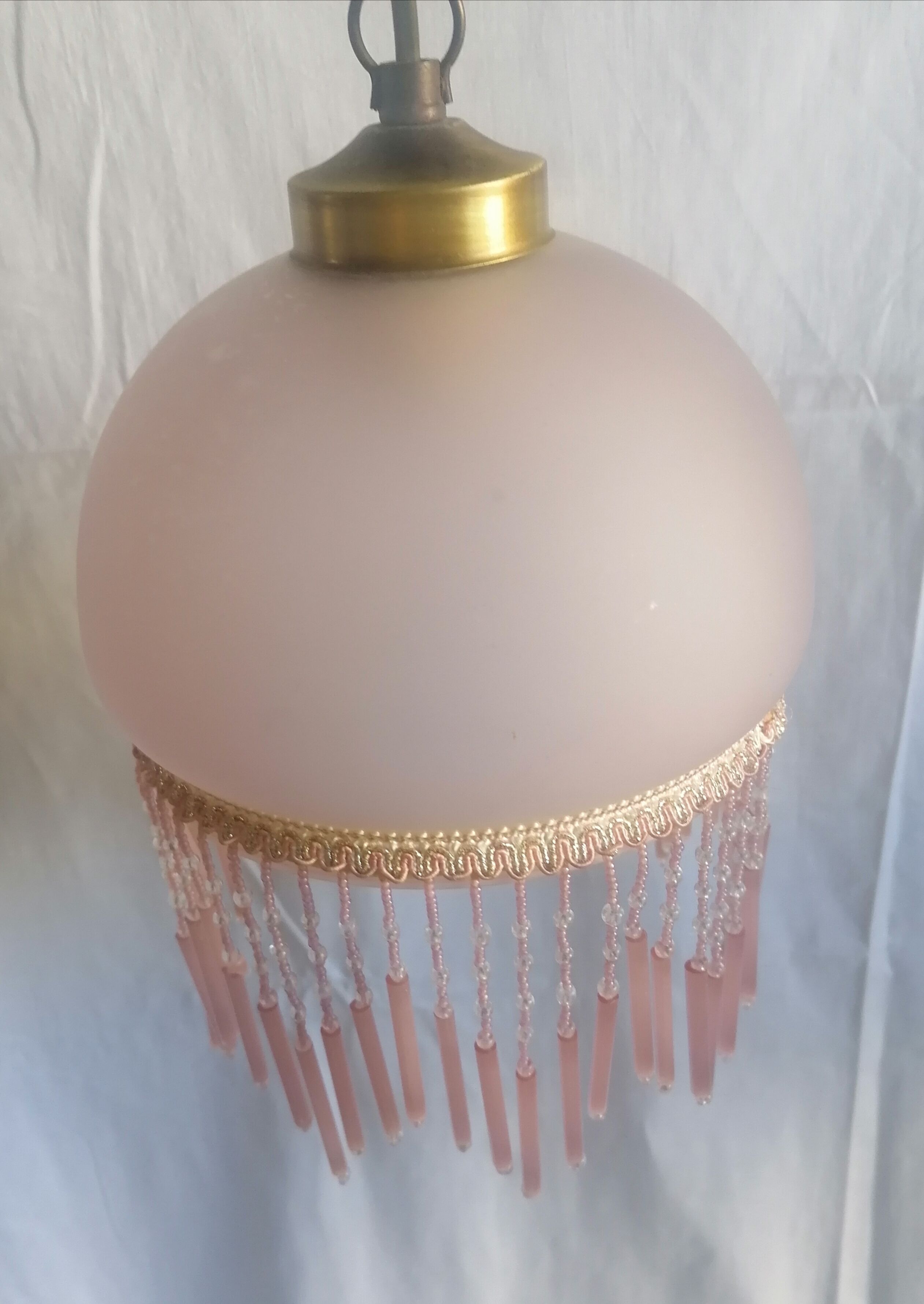 Hanging bell and pink glass garland