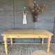 Old farmhouse table in raw wood