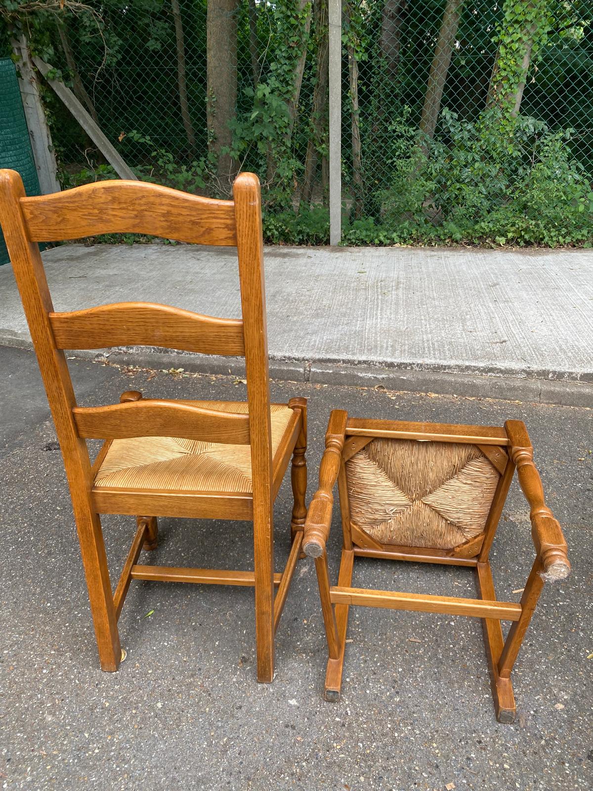 6 solid oak dining chairs with rush seats from the 1980s.