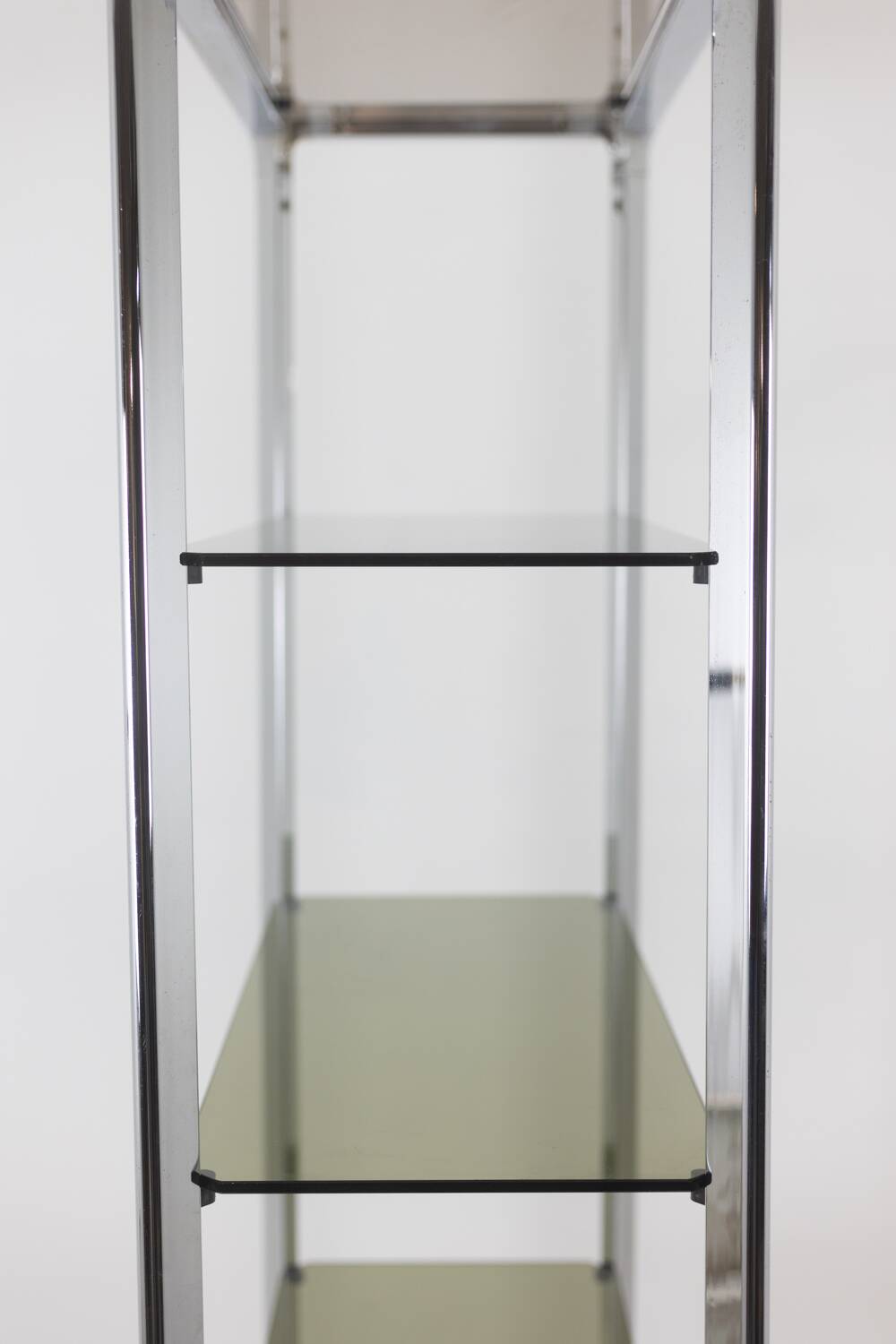 Pair of 6-shelf shelves with chrome-plated metal frames. 1970s.