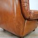 2 fauteuils en cuir cognac, années 1970