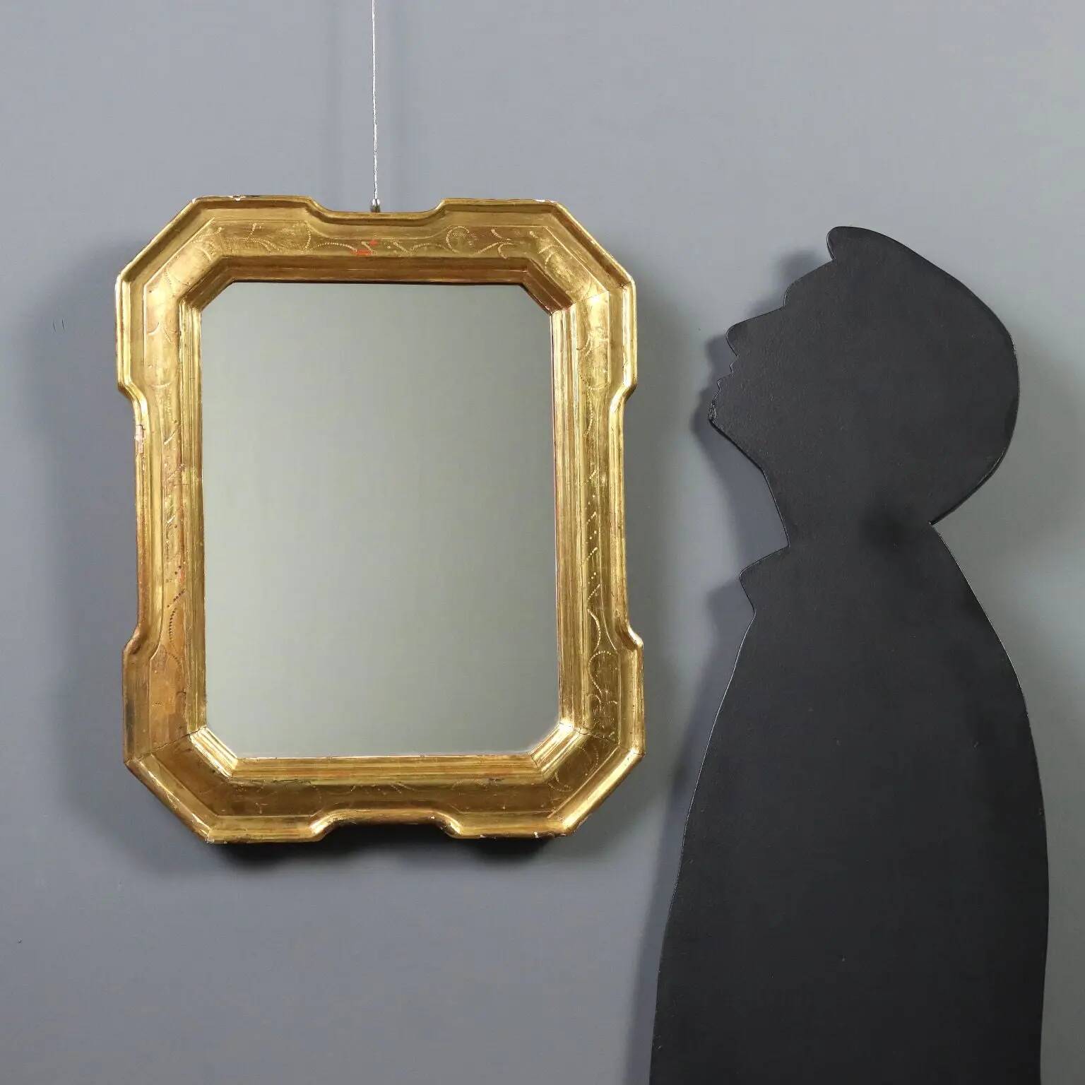 Antique cabaret mirror in gilded wood, Italy, mid-19th century.
