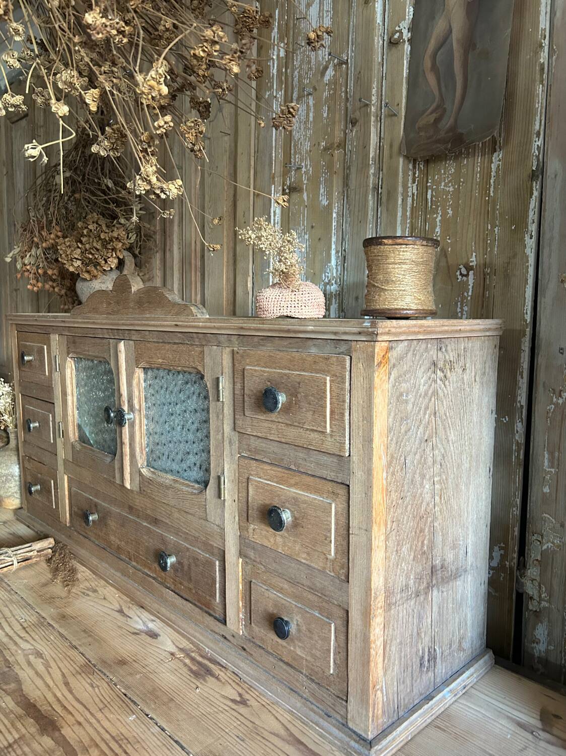 Small piece of furniture with glass doors and drawers