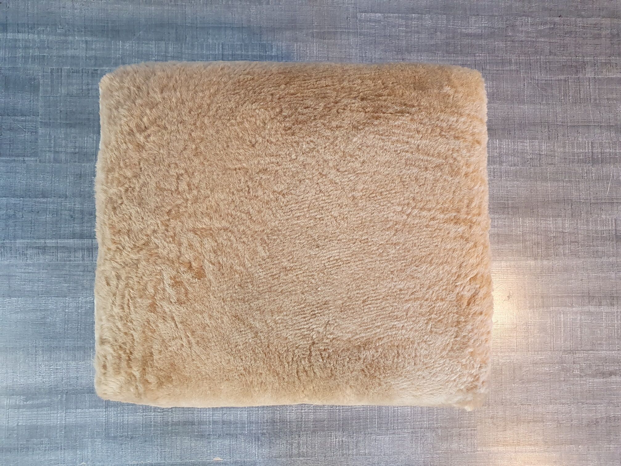 Norwegian sheepskin wing armchair with ottoman 1950