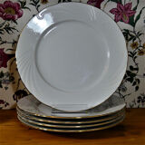 Cinq assiettes de table en porcelaine