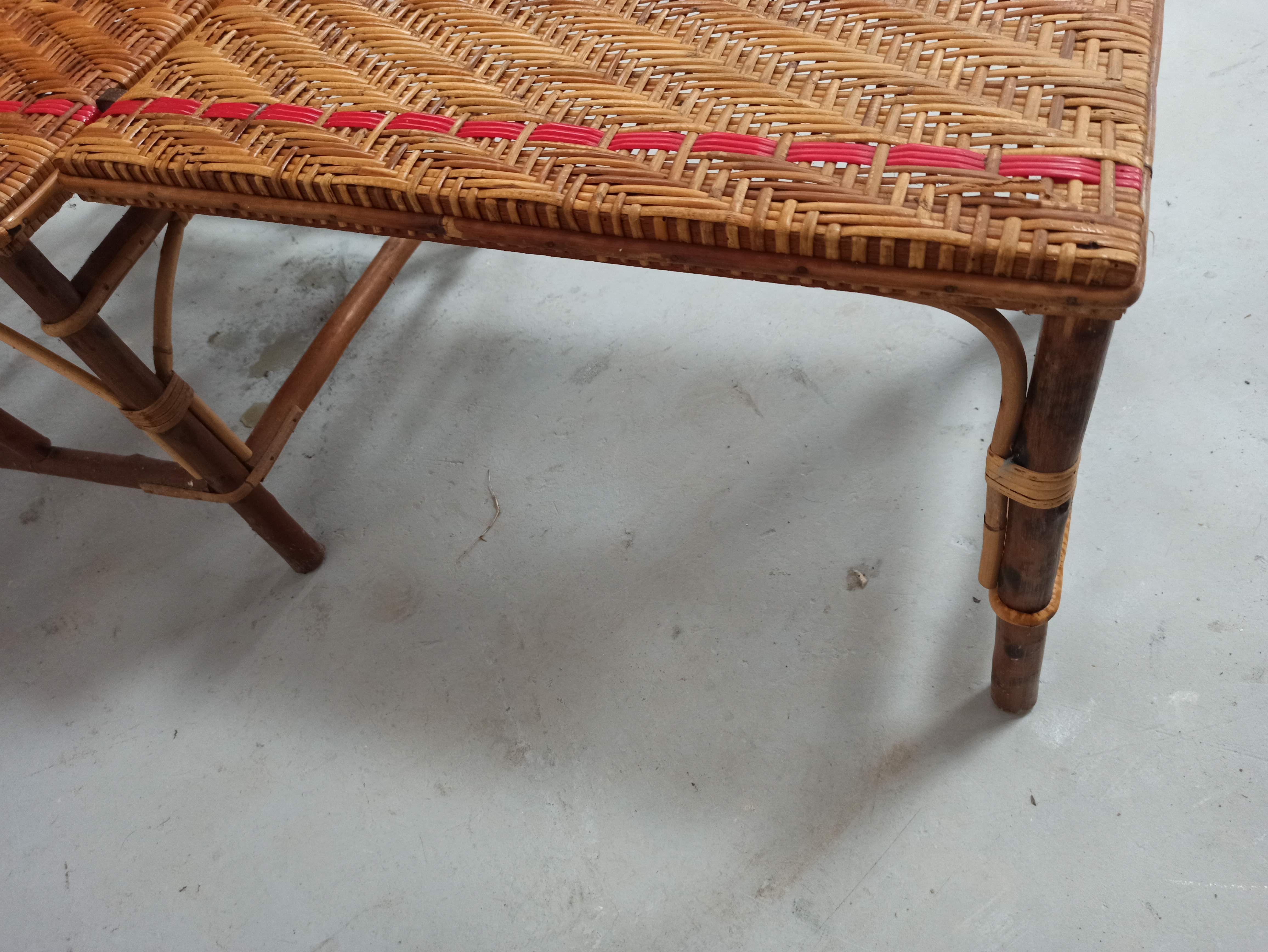 Sunbathing sunbathing in wicker rattan wood deckchair red lounger