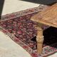 Brown Indonesian teak coffee table, with a border and cylindrical legs H40 L103.