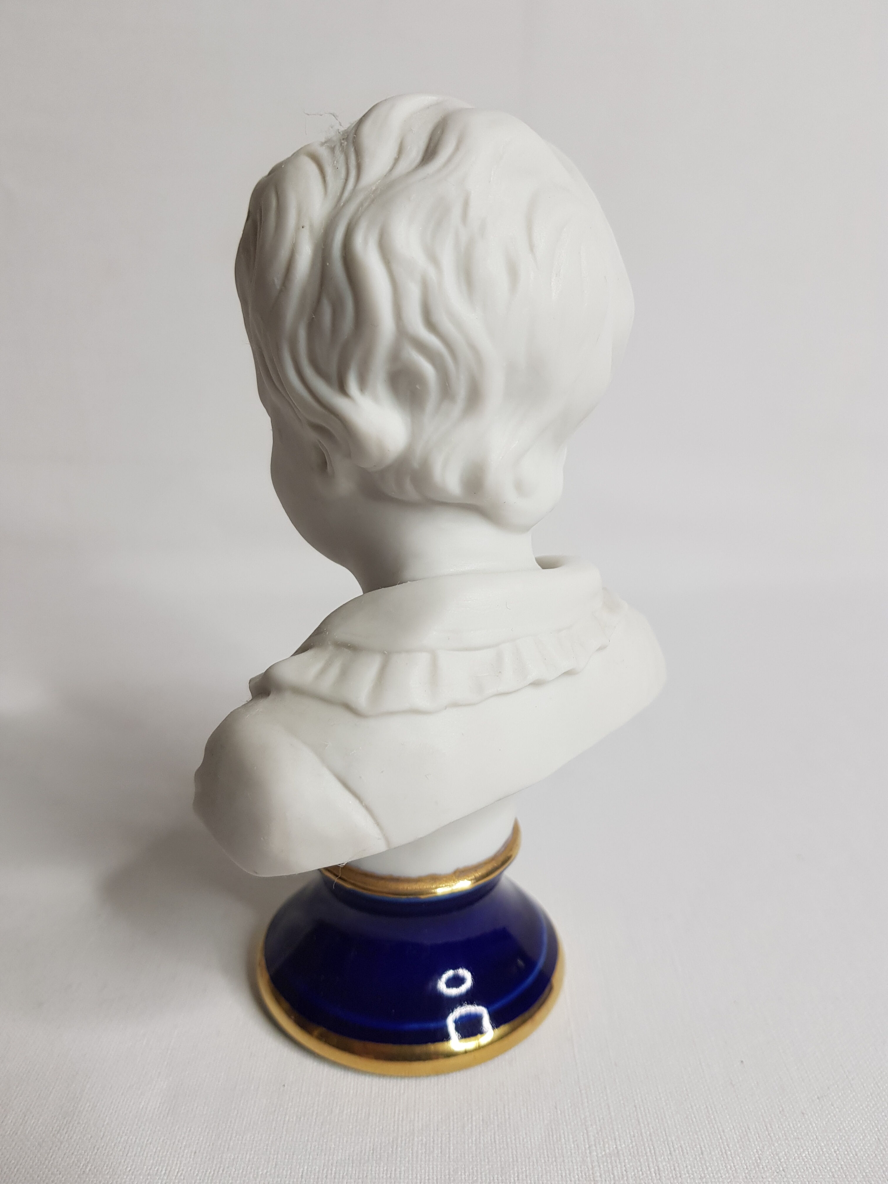 Porcelain biscuit bust, child, Alexandre Brongniart after Houdon