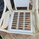 Pair of white rattan armchairs