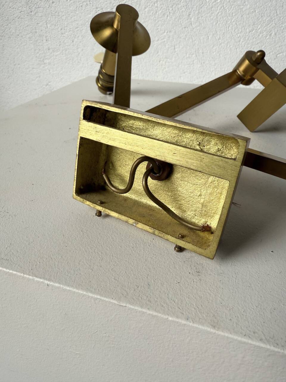 Pair of brass wall lights with articulated arms from the 70s