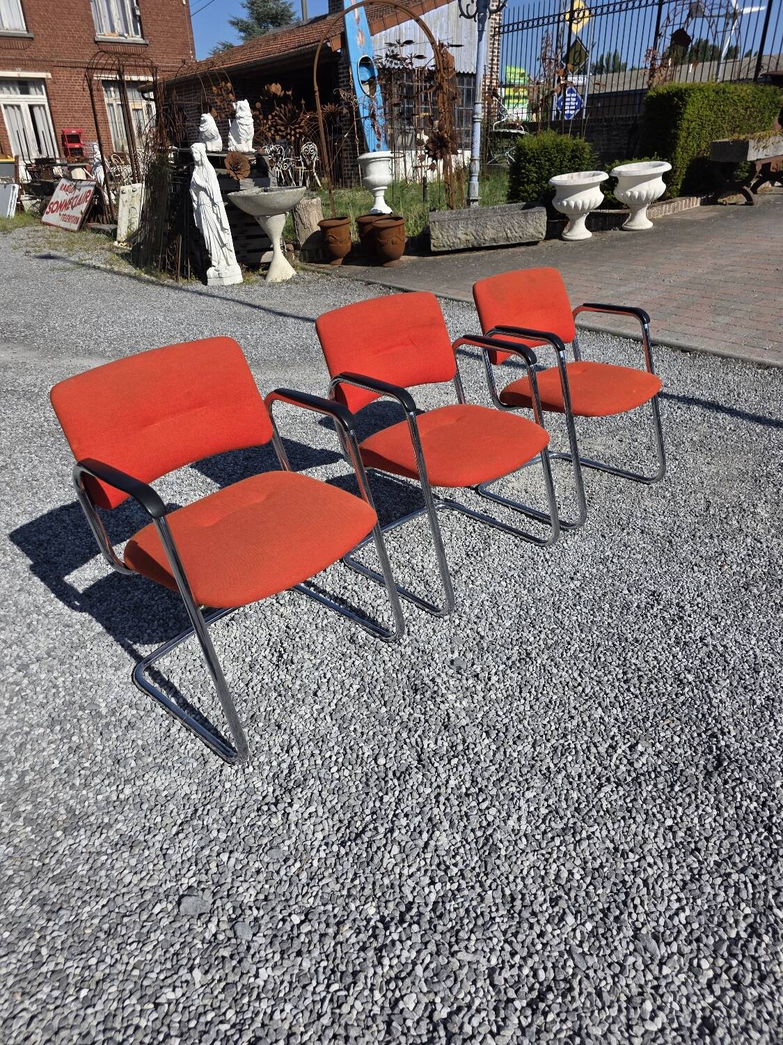 3 vintage chrome metal armchairs with orange fabric tops