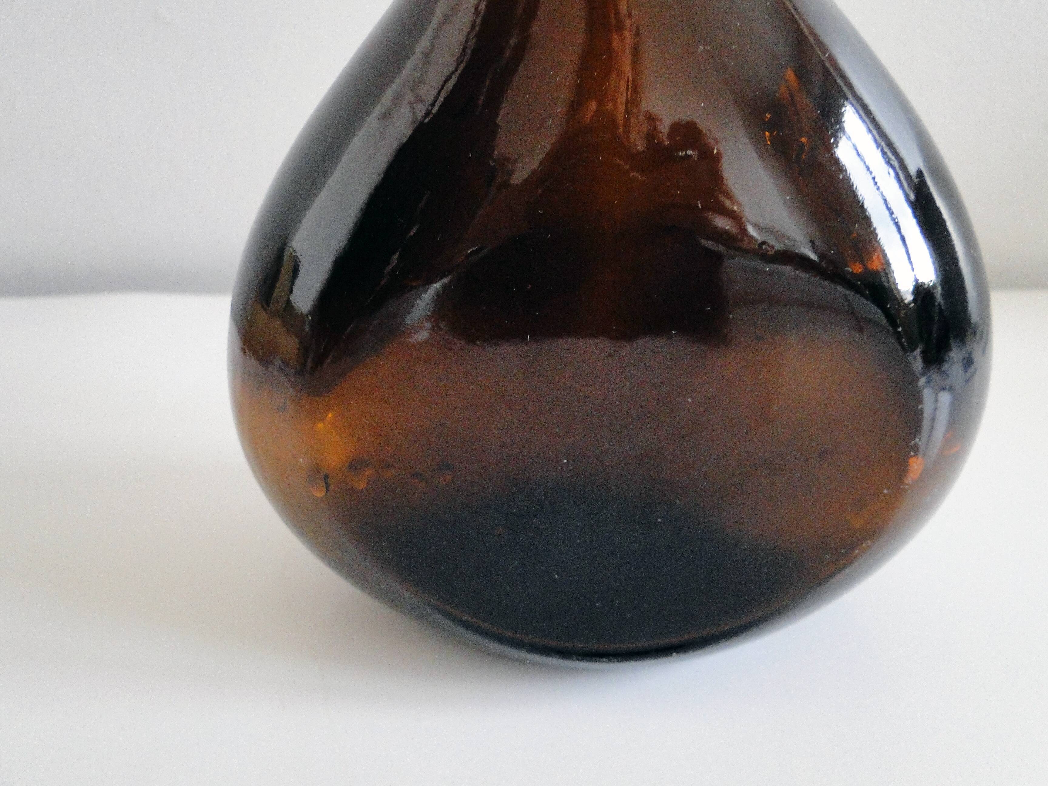 Old and original blown glass bottle with XXth bent neck