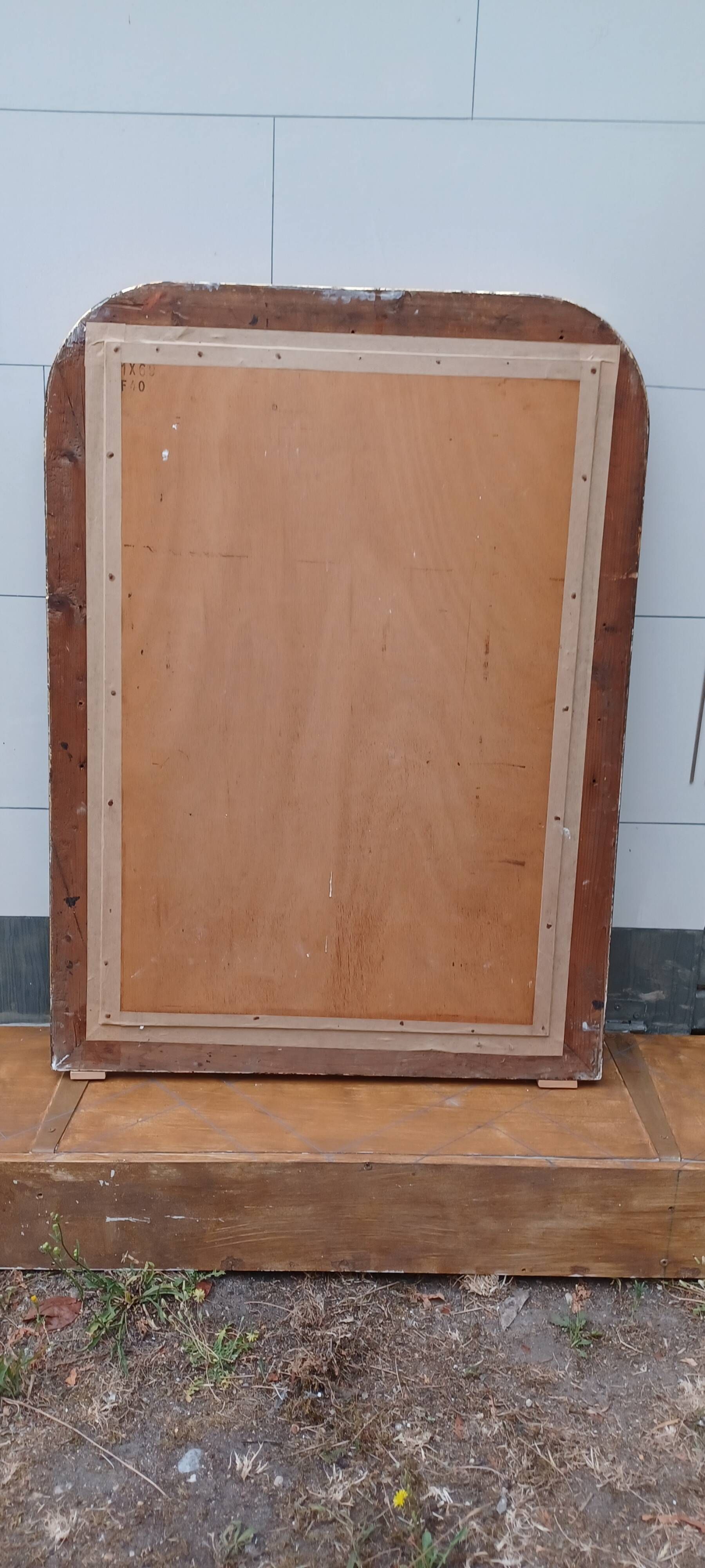 Louis-philippe grey and gilt mirror decorated in the antique style