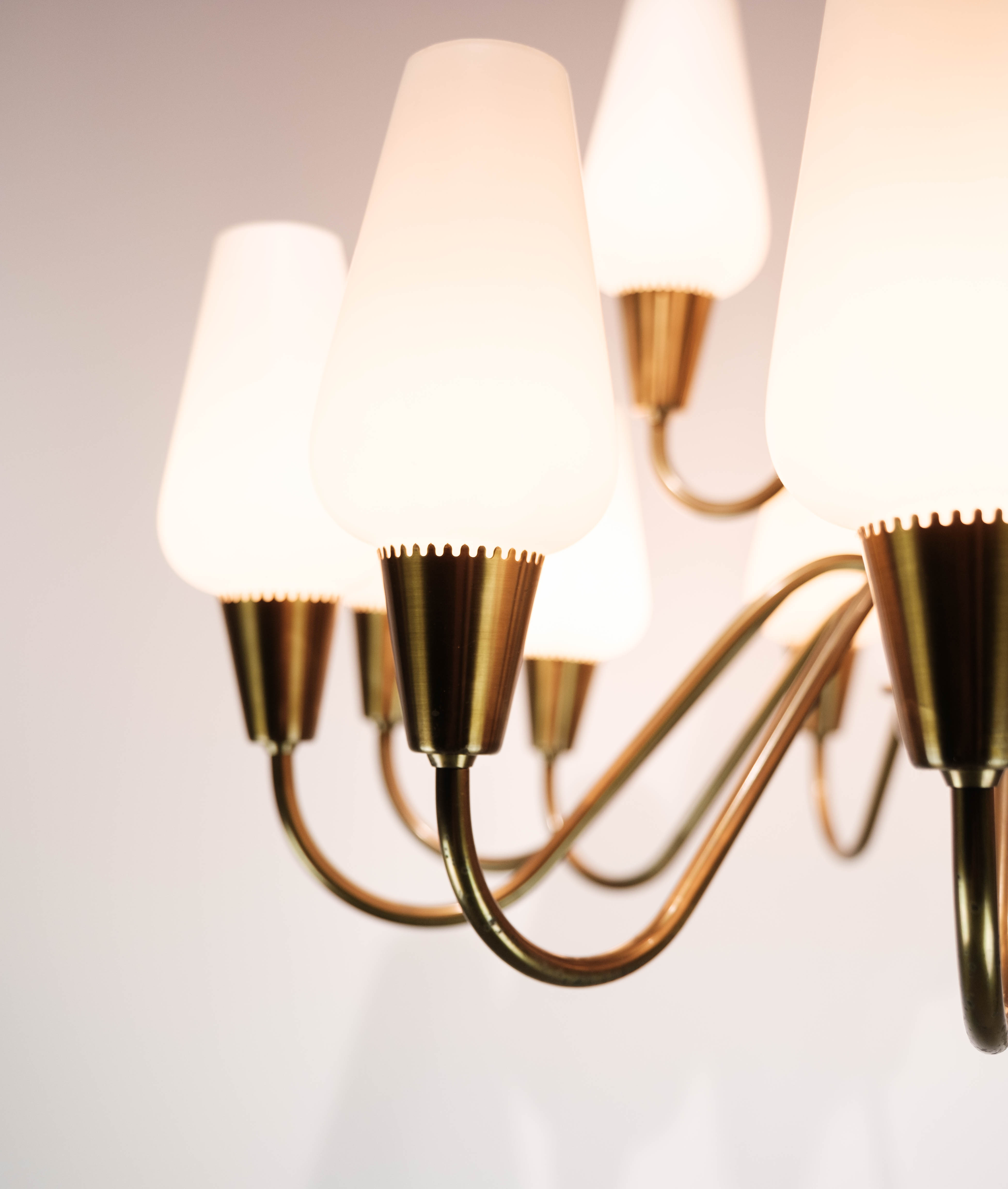 Lamp with arms of brass and glass, of Danish design from the 1950s