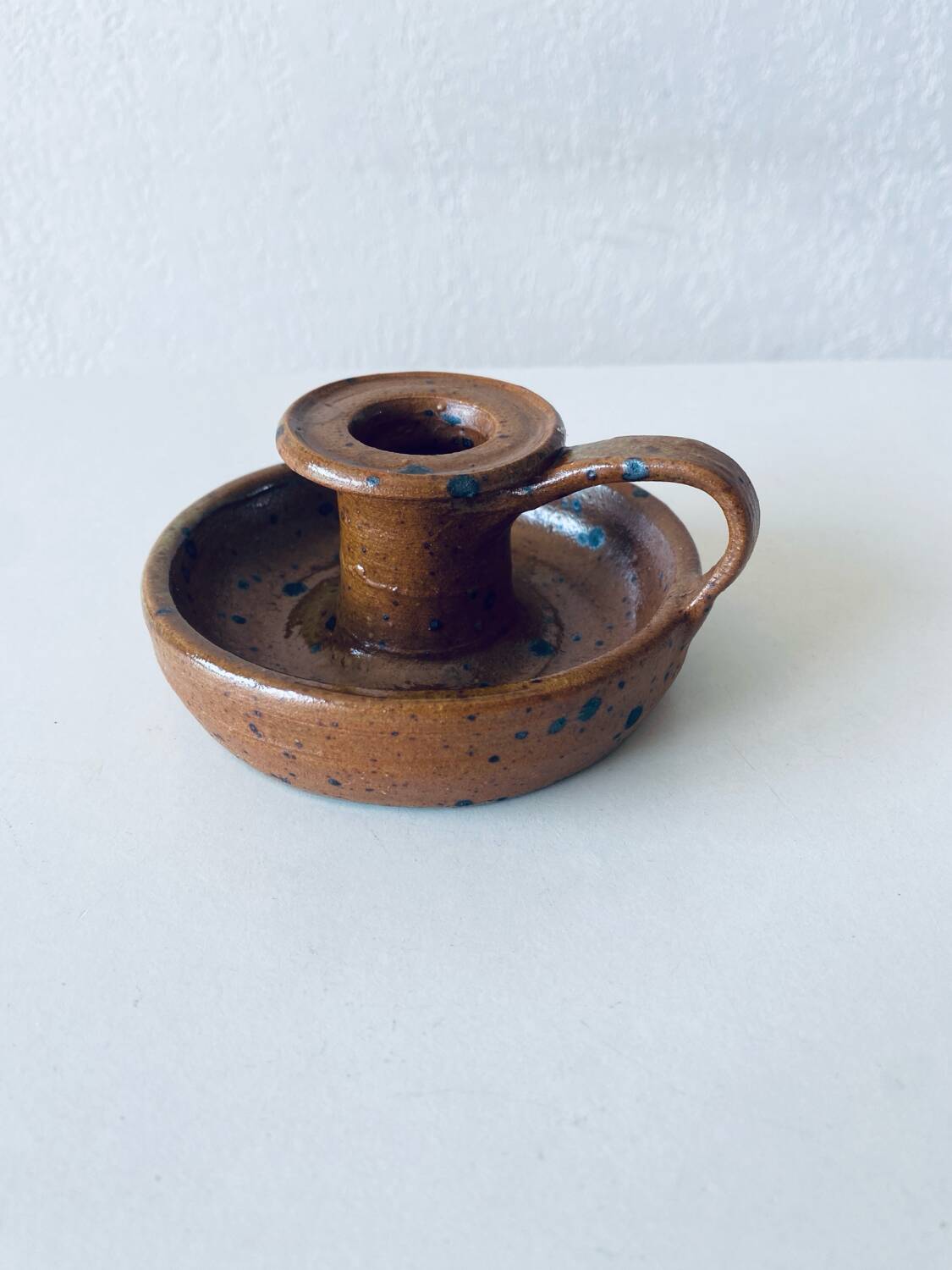 Signed sandstone candle holder