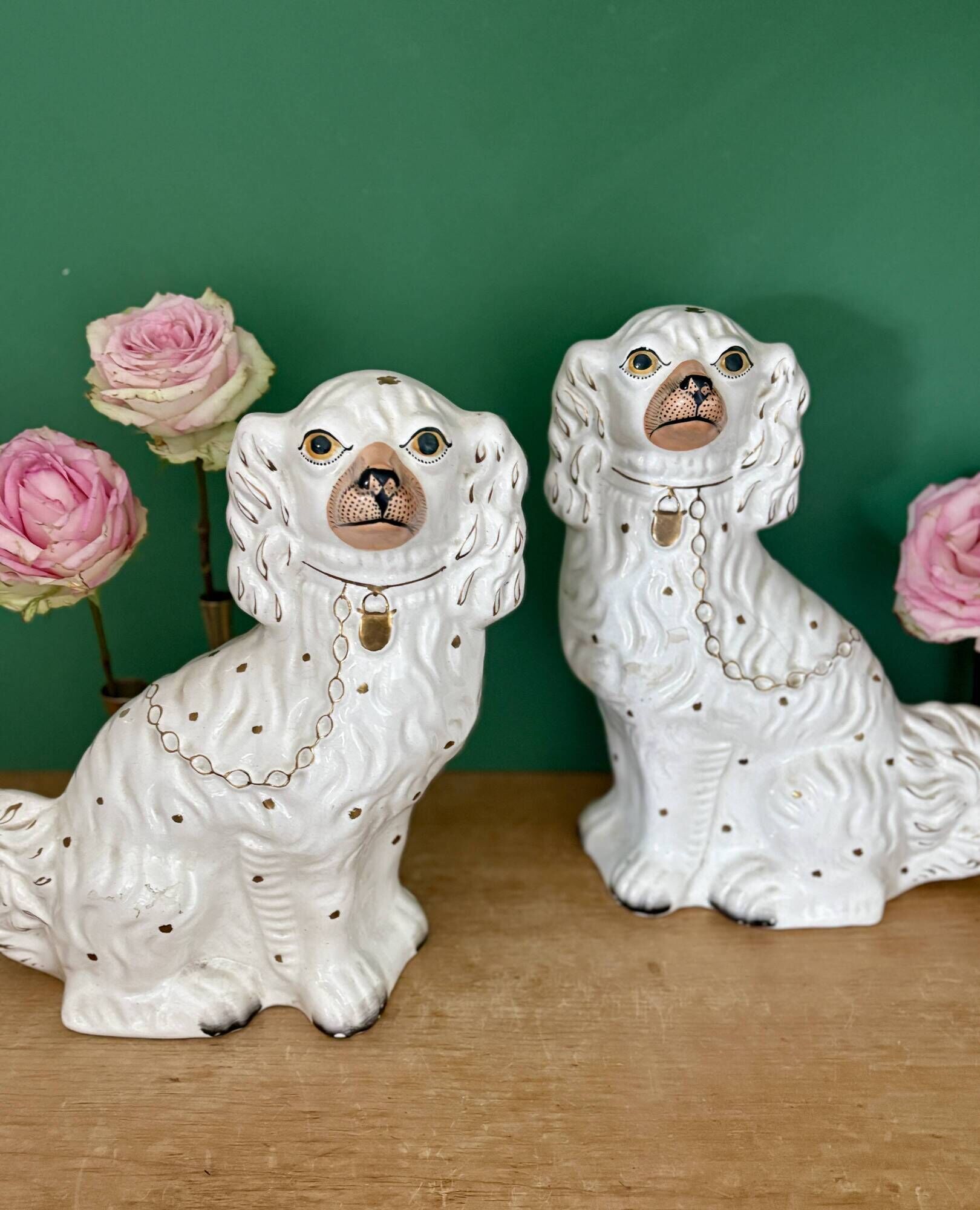 Pair of Staffordshire-type dogs in white and gold ceramic