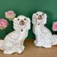 Pair of Staffordshire-type dogs in white and gold ceramic