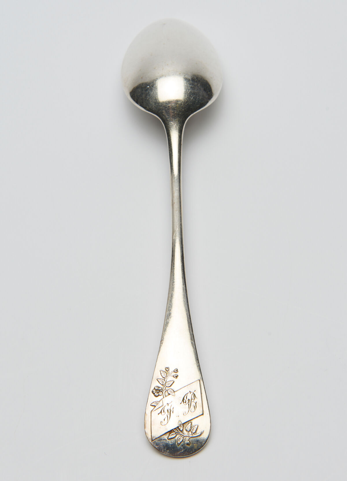 12 small silver metal spoons engraved "FB", early XXth