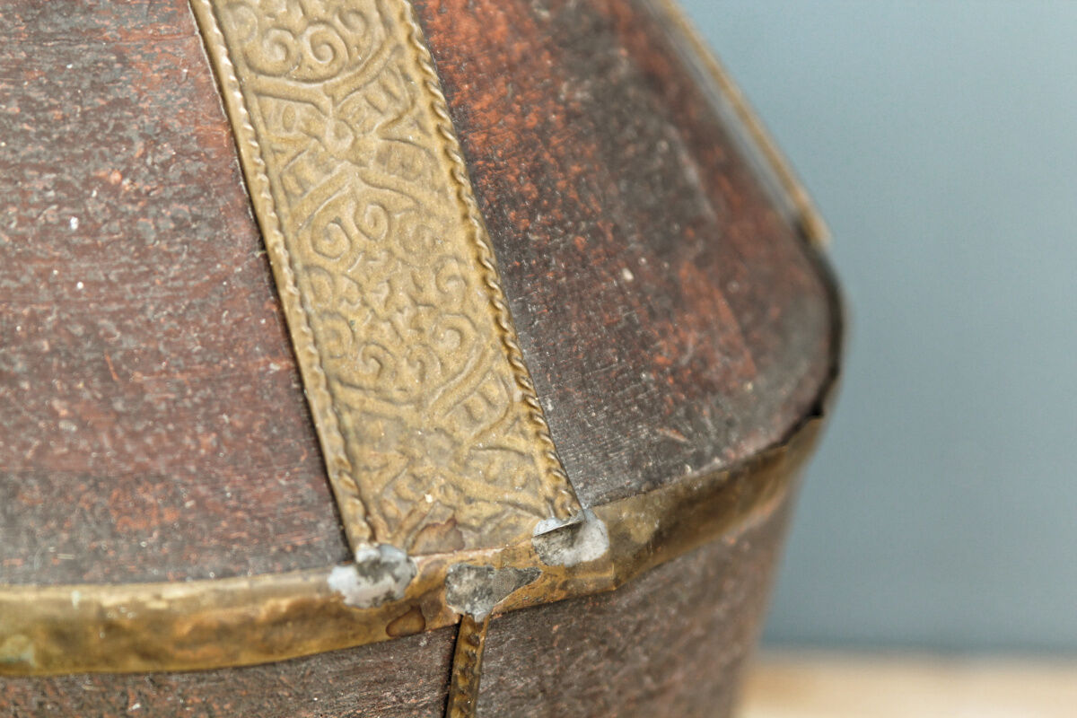 Old terracotta and brass bottle