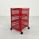 Chest of drawers on red metal wheels, 1980